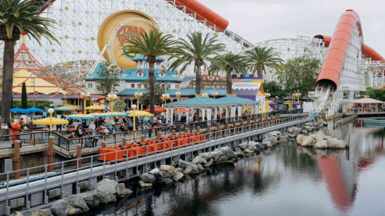 a-roller-coaster-ride-next-to-a-body-of-water
